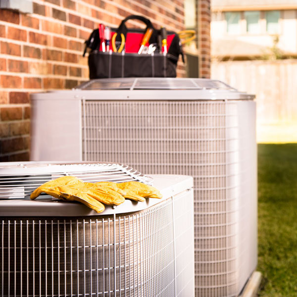 HVAC unit with tool bag on top