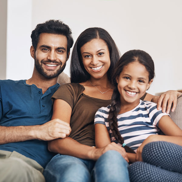 family of three smiling